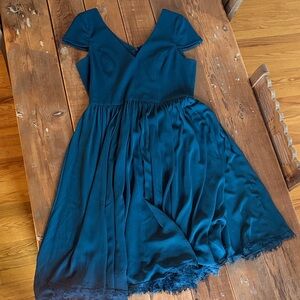 Elegant Green Dress with Lace Hem